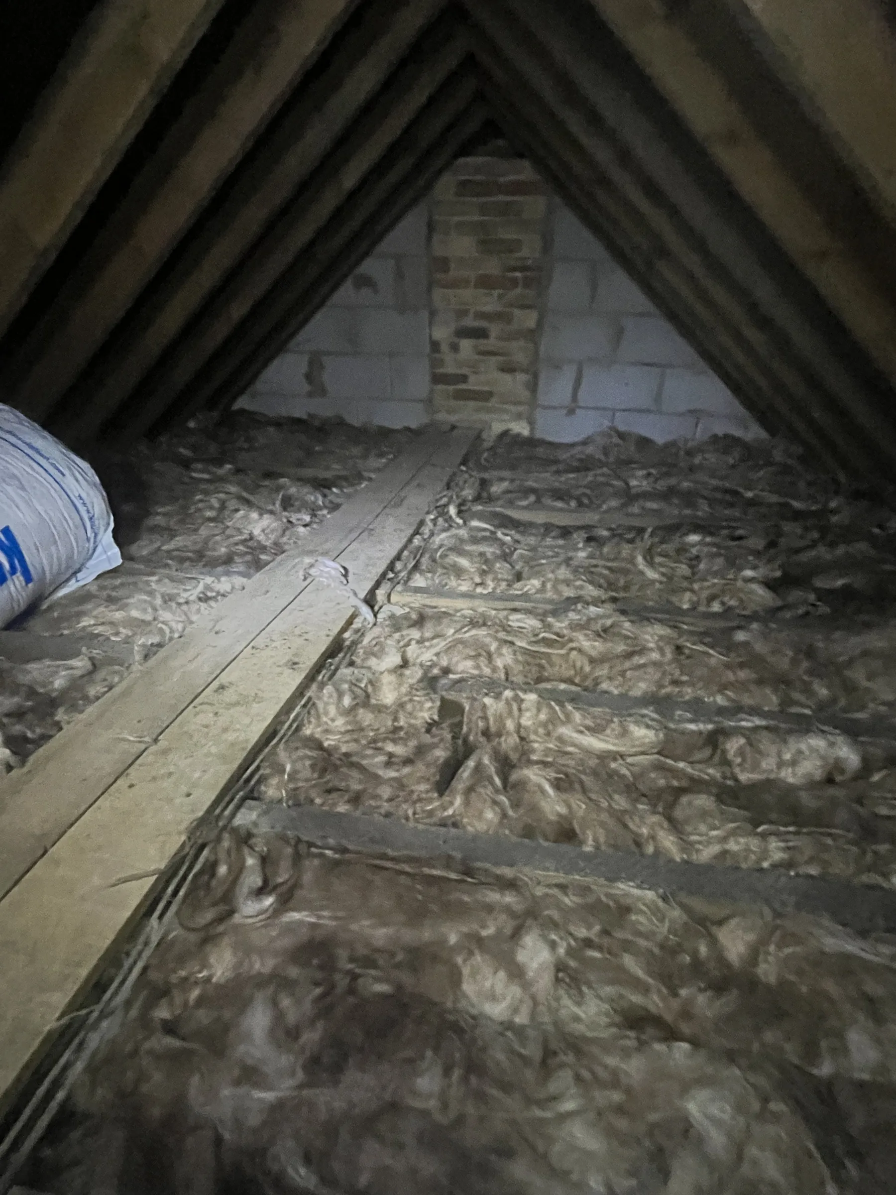 Regulation depth loft insulation fitted neatly