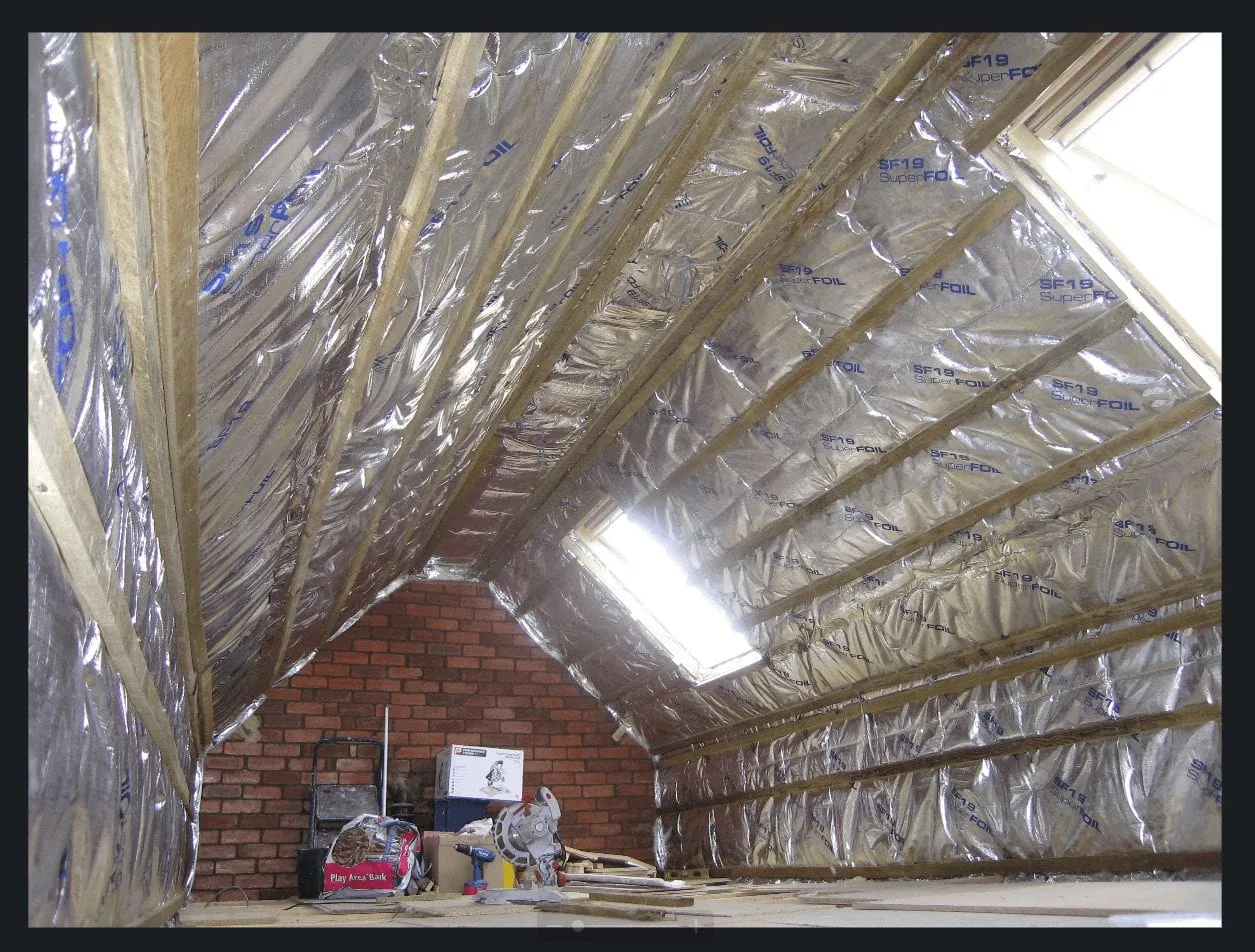 Superfoil insulation installed across a pitched loft roof